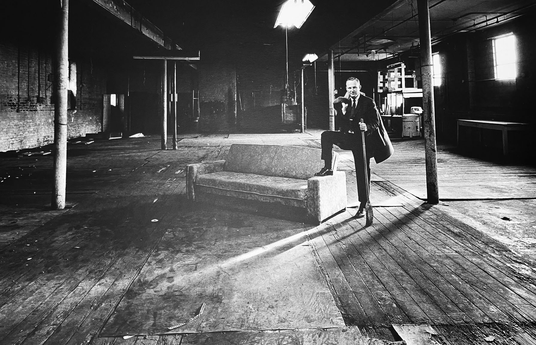 Harvey Mackay on a couch in the warehouse